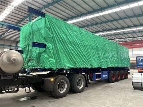 Two groups of 4-axle 50-ton side-tipping dump trailer completed loading and w...